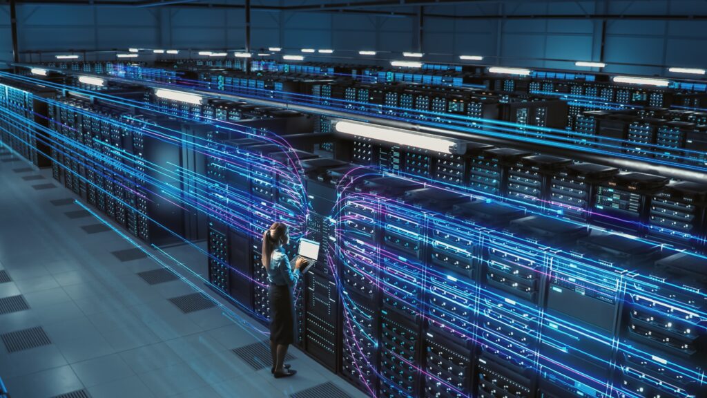Big Data Center Female Chief Technology Officer Using Laptop Activates Servers, Information Digitalization Starts. SAAS, Cloud Computing, Web Service